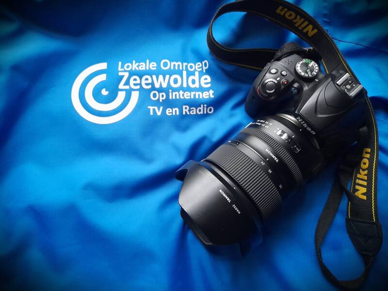 LOZ jas met fototoestel daar bovenop